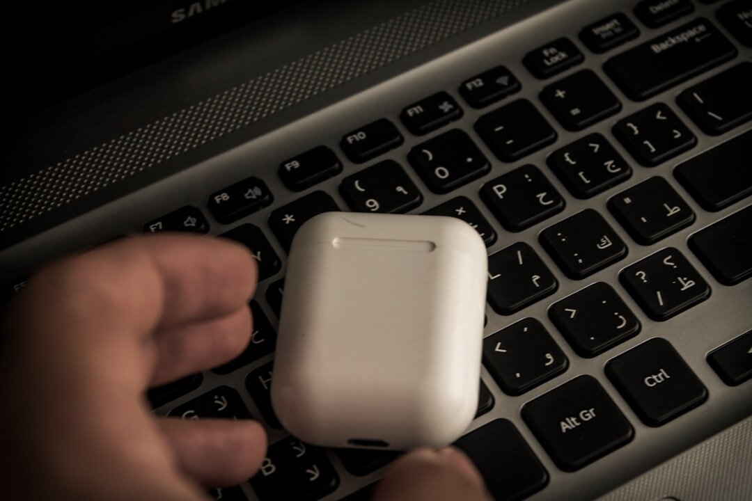 Close up of hands typing on a laptop keyboard